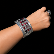 Repoussé and Garnet Sterling Cuff by M. Guerro