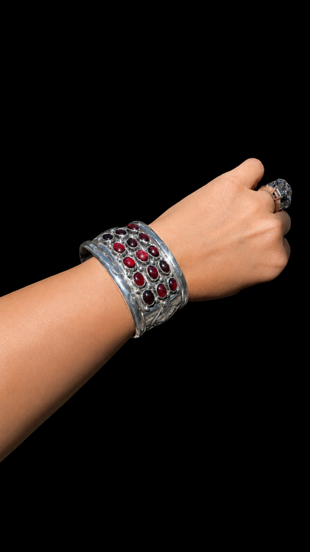 Repoussé and Garnet Sterling Cuff by M. Guerro